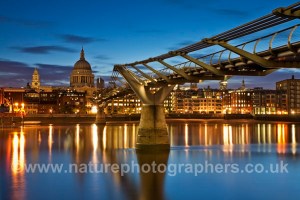 Millennium Bridge over the River Thames looking towards St Paul's Cathederal at dawn, London, Uk